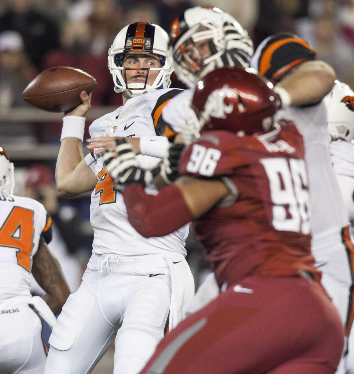 Oregon State quarterback Sean Mannion, left, attempts a pass during the first quarter against Washington State on Saturday, Oct. 12, 2013, at Martin Stadium in Pullman, Wash.