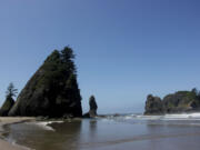 Sea rock formations known as the Point of Archers stand under the afternoon sun near Shi Shi Beach in Washington state's Olympic National Parks. Point of Archers offers hikers and campers great spots to explore sea creatures during low tide.