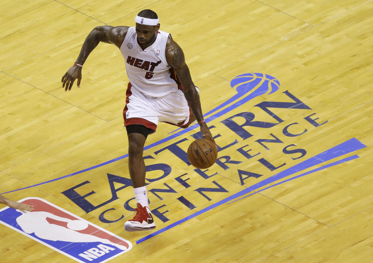 Miami Heat small forward LeBron James dribbles the ball during the first half of Game 7 against the Indiana Pacers on Monday.