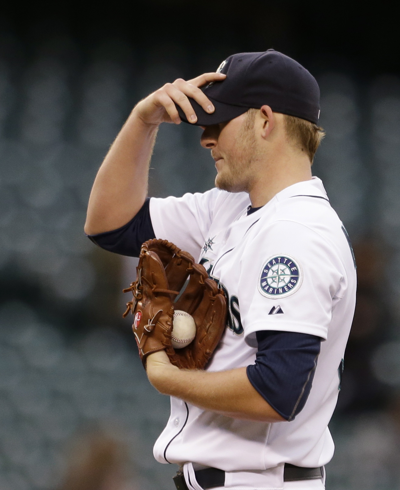 Seattle Mariners starting pitcher Brandon Maurer adjust his cap after giving up a two-run home run to the San Diego Padres in the fourth inning.