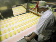 Roger Hildebeitel inspects Peeps as they move through the manufacturing process at the Just Born factory in Bethlehem, Pa.