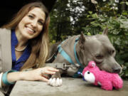 Lawyer Mitzi Bolanos poses with her pit bull, Bubba, at Lewis &amp; Clark Law School in Portland.