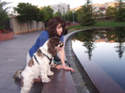 Carol Bryant of Forty Fort, Pa., and her cocker spaniel, Dexter, at Salt Lake City Temple in Salt Lake City, Utah.