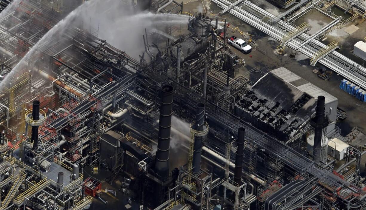 A chemical plant is hosed down after a fire in this aerial photo about 20 miles southeast of Baton Rouge, in Geismer, La., on Thursday.