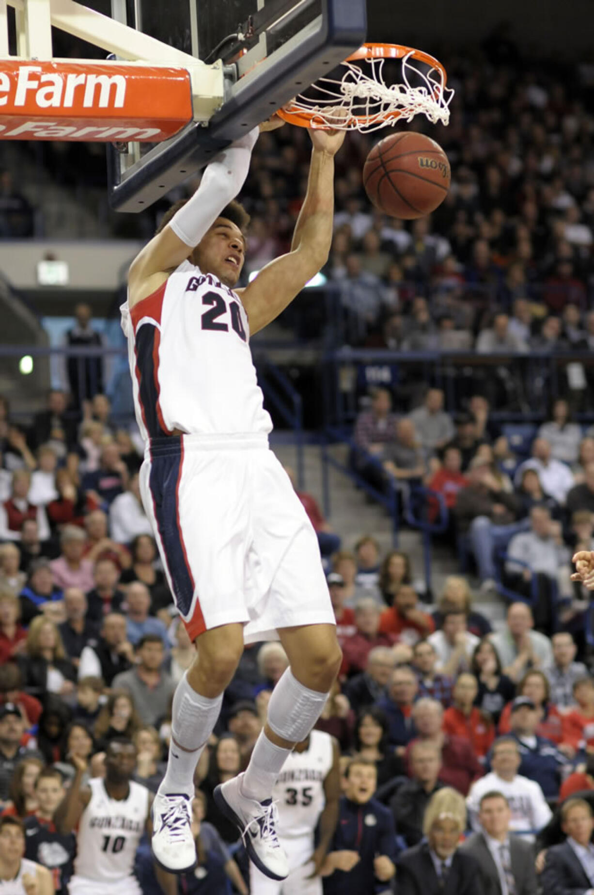 Gonzaga's Elias Harris (20) dunks against Portland in the second half Saturday. Gonzaga defeated Portland 81-52.