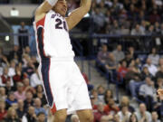 Gonzaga's Elias Harris (20) dunks against Portland in the second half Saturday. Gonzaga defeated Portland 81-52.