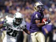 Portland State's Michael Williams (25) gives chase as Washington's Jaydon Mickens runs after a pass reception in the first half of an NCAA football game on Saturday, Sept. 15, 2012, in Seattle.