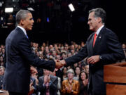 President Barack Obama shakes hands with Republican presidential nominee Mitt Romney after the first presidential debate at the University of Denver, Wednesday in Denver.