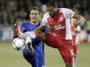 Portland forward Ryan Johnson, right, battles for possession with Colorado defender Shane O'Neill.