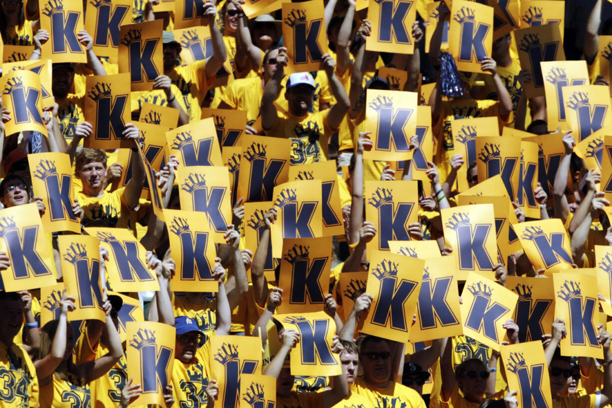 Fans in a special section for Seattle Mariners starting pitcher Felix Hernandez cheer and hold up &quot;K&quot; cards for strikeouts during a game against the Tampa Bay Rays, Wednesday in Seattle.