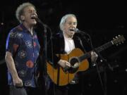 Paul Simon, right, and Art Garfunkel perform at the 25th Anniversary Rock &amp; Roll Hall of Fame concert at Madison Square Garden in New York.