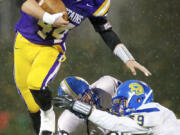 Columbia River's Remick Kawawaki (44), playing here against Bainbridge in a Class 3A playoff game, will be dodging tackles -- or making them -- in the Ivy League next fall for the Yale Bulldogs.