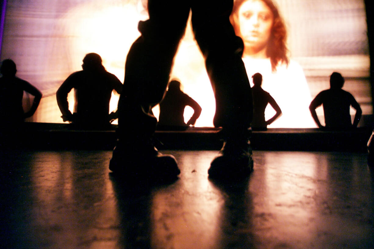 As The Rocky Horror Picture Show plays on a screen behind them, members of the audience take to the stage to dance to the &quot;time warp&quot; song.