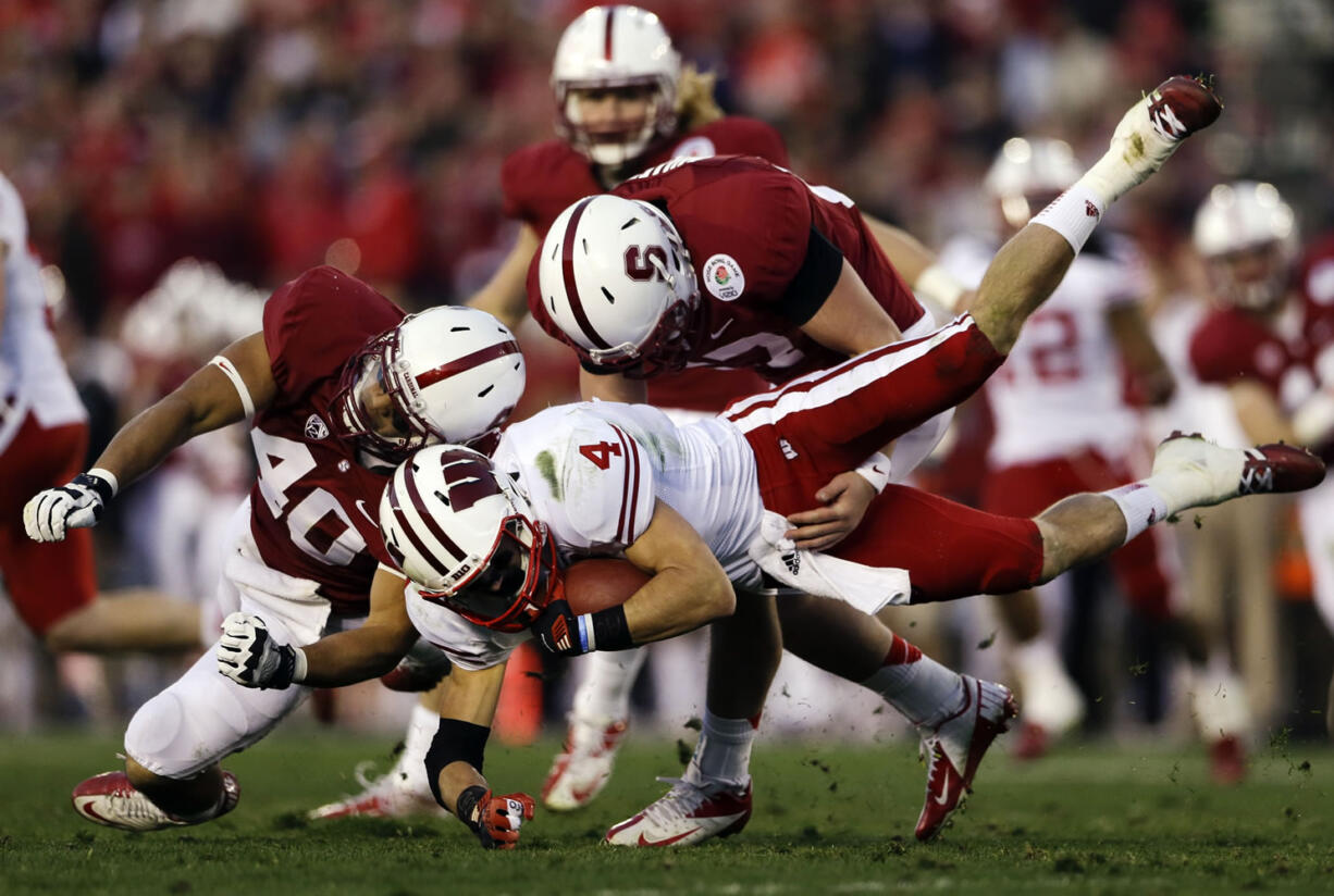 Wisconsin wide receiver Jared Abbrederis is hit by Stanford linebacker Joe Hemschoot (40) during the second half of the Rose Bowl on Tuesday.