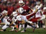 Wisconsin wide receiver Jared Abbrederis is hit by Stanford linebacker Joe Hemschoot (40) during the second half of the Rose Bowl on Tuesday.