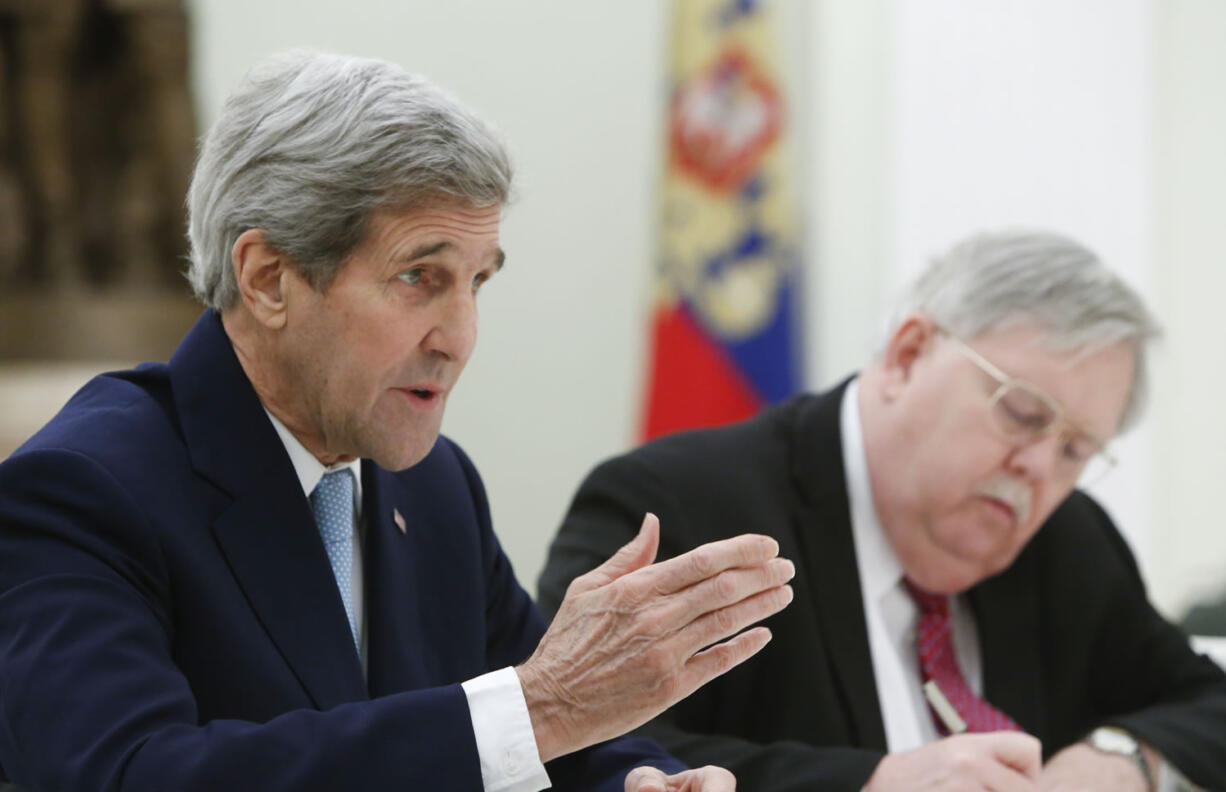 U.S. Secretary of State John Kerry, left, flanked by U.S. Ambassador to Russia John Tefft, meets with Russian President Vladimir Putin in the Kremlin in Moscow, Russia, on Tuesday. The United States and Russia need to find common ground to end Syria&#039;s civil war and restore stability in eastern Ukraine, U.S. Secretary of State John Kerry said Tuesday, as he met with Russian President Vladimir Putin to try to narrow gaps in the countries&#039; approaches to the crises.