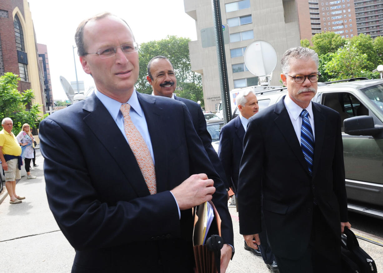 General Council for SAC Capital Advisors LP, Peter Nussbaum, second left, exits Manhattan federal court, Friday in New York.