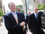 General Council for SAC Capital Advisors LP, Peter Nussbaum, second left, exits Manhattan federal court, Friday in New York.