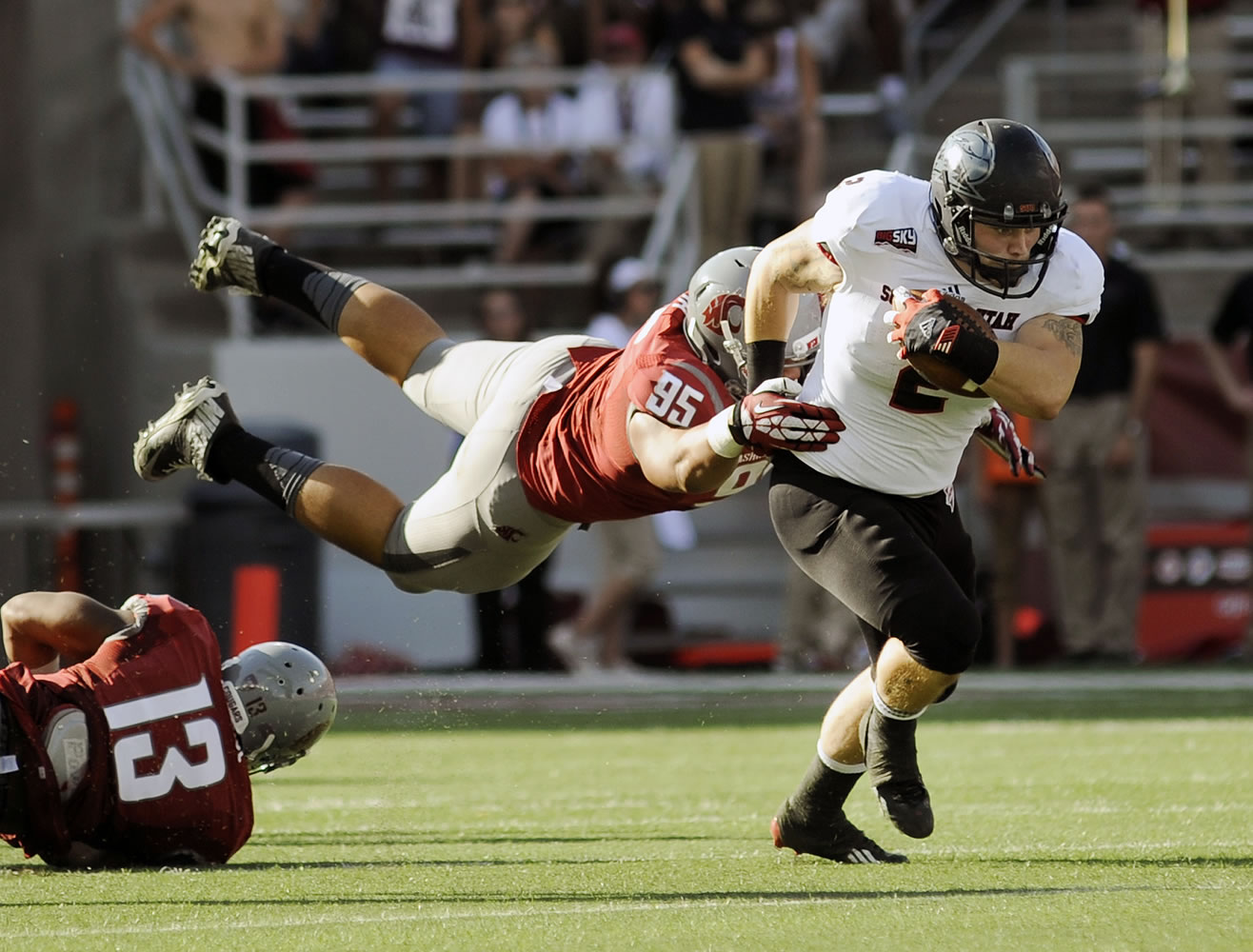 Washington State's Ioane Gauta wraps up Southern Utah's Nolan Washington during the first half Saturday.