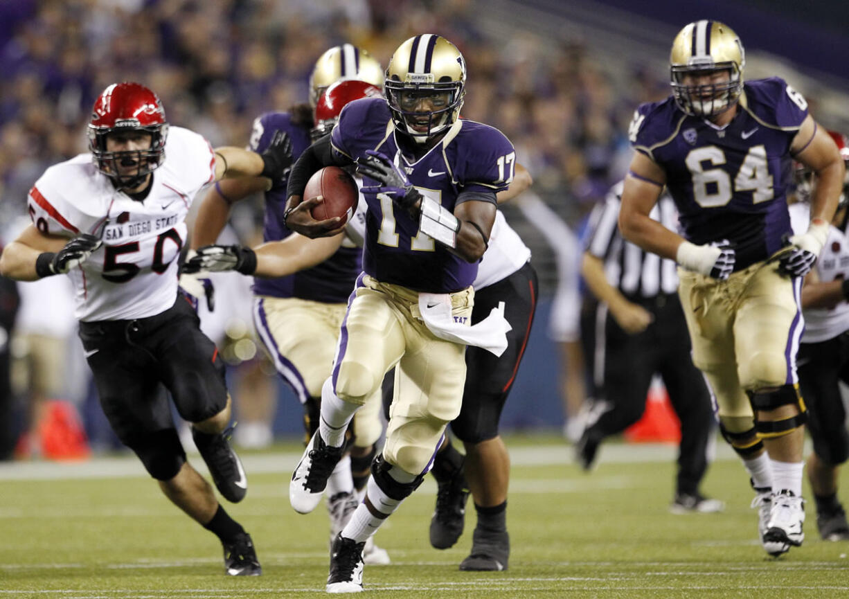 Washington quarterback Keith Price runs against San Diego State during the Huskies' 21-12 in on Saturday.