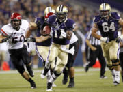 Washington quarterback Keith Price runs against San Diego State during the Huskies' 21-12 in on Saturday.