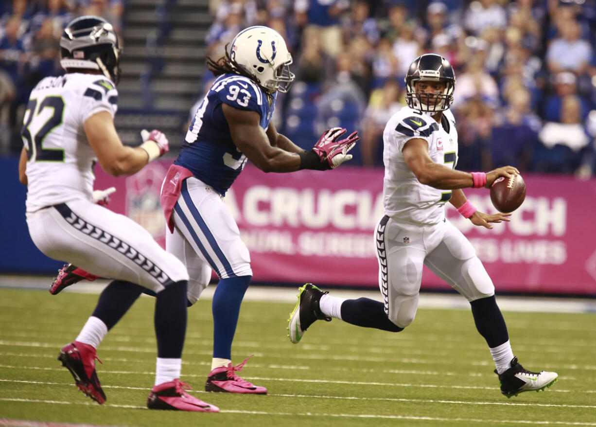 Seattle Seahawks quarterback Russell Wilson scrambles Sunday against Indianapolis.