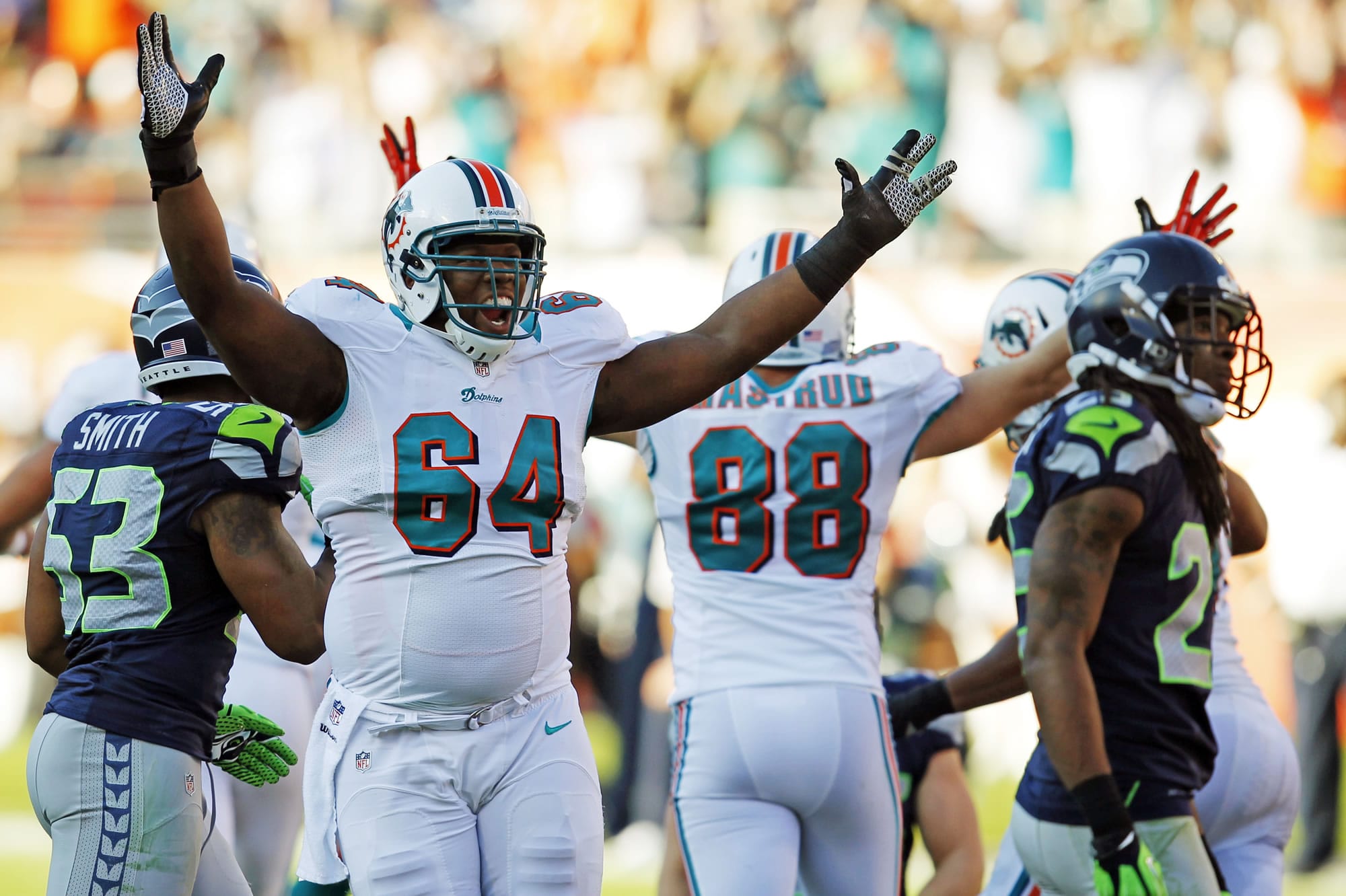 Miami Dolphins guard Josh Samuda (64) celebrates after kicker Dan Carpenter made the winning field goal to beat the Seattle Seahawks 24-21 on Sunday.