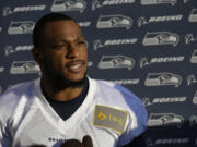 Seattle Seahawks wide receiver Percy Harvin talks to reporters following NFL football practice, Tuesday, Oct. 22, 2013, in Renton, Wash. It was Harvin's first full team practice since he injured his hip during the off-season. (AP Photo/Ted S.