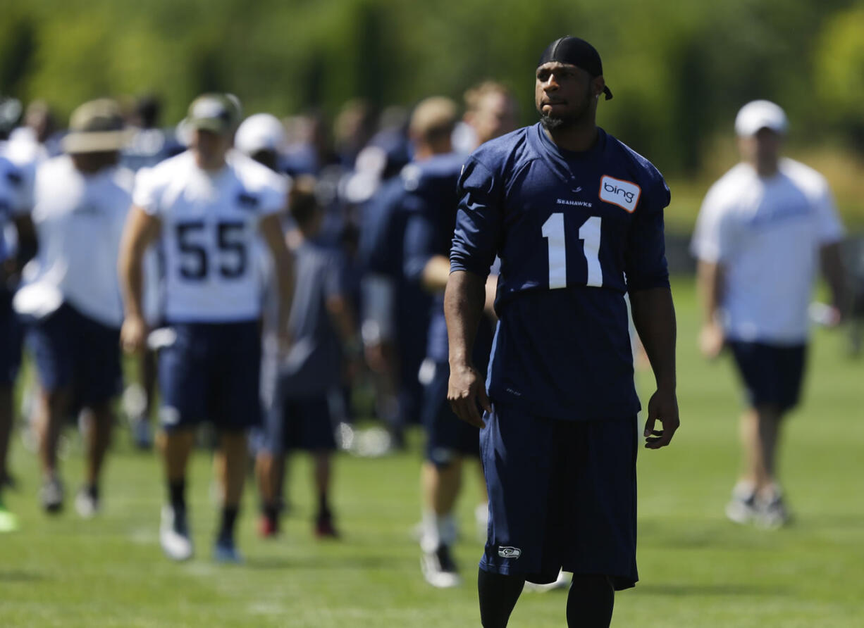 Injured Seattle Seahawks wide receiver Percy Harvin (11) walks off the field following NFL football training camp on Saturday, July 27, 2013, in Renton, Wash. Harvin will get a second opinion on his sore hip next week in New York, and Seattle coach Pete Carroll says all options remain for how the injury is handled. (AP Photo/Ted S.