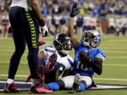 Detroit Lions wide receiver Titus Young (16) celebrates his winning touchdown reception against Seattle Seahawks cornerback Brandon Browner (39) in the end zone during the second half of an NFL football game, Sunday, Oct. 28, 2012. in Detroit. The Lions won 28-24.