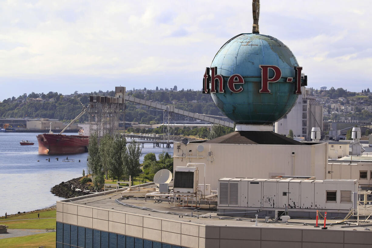 The iconic 18-ton rotating globe sits atop the building housing offices of the seattlepi.com, the web-only news site born out of the Seattle Post-Intelligencer, overlooking Elliiott Bay in Seattle.