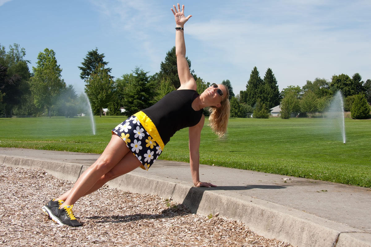 Sherri McMillan demonstrates a rotation plank exercise.