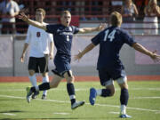 Carter Johnson, 14, and Austin Horner, 3, of Skyview High School celebrate a goal off a header during the first half against Central Kitsap in the boys 4A State Soccer Championship game Saturday May 26, 2012 at Carl Sparks Stadium in Puyallup, Washington. Horner set up the goal as Johnson scored from the pass. Skyview beat Central Kitsap 3-2.