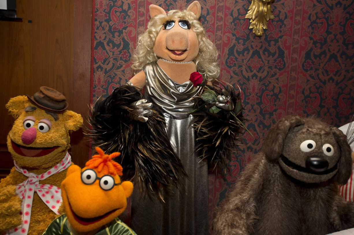 A Miss Piggy &quot;muppet&quot;, center, is joined by, from left, Fozzie Bear, Scooter and Rowlf during a ceremony to donate additional Jim Henson objects to the Smithsonian's National Museum of American History in Washington.