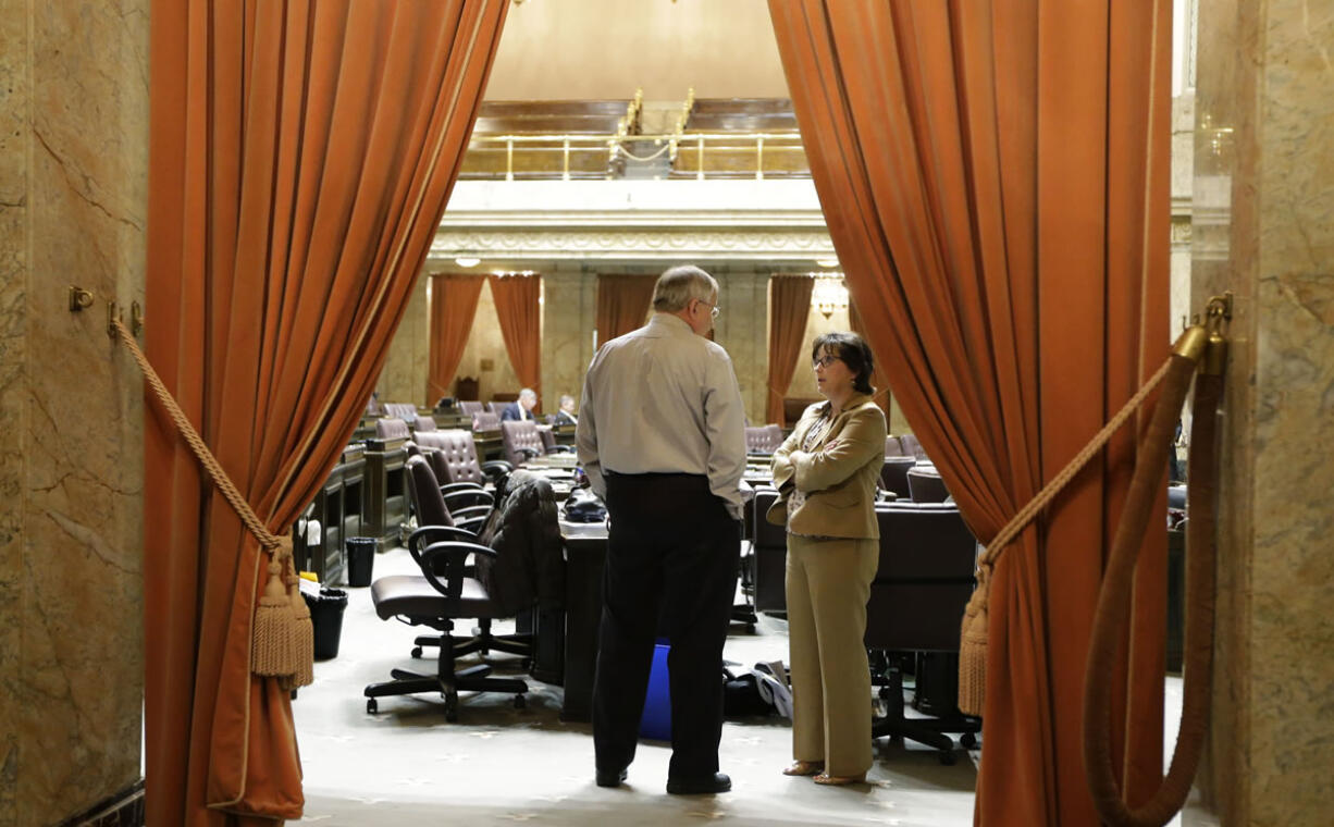 House Speaker Frank Chopp, left, D-Seattle, talks with Rep.