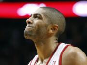 Portland Trail Blazers forward Nicolas Batum, from France, grimaces after missing a three point shot with just seconds to go during the second half of their NBA basketball game against the San Antonio Spurs in Portland, Ore., Saturday, Nov. 10, 2012.