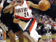 Don Ryan/The Associated Press
Portland Trail Blazers guard Ronnie Price, right, drives on San Antonio Spurs guard Gary Neal during the first half.