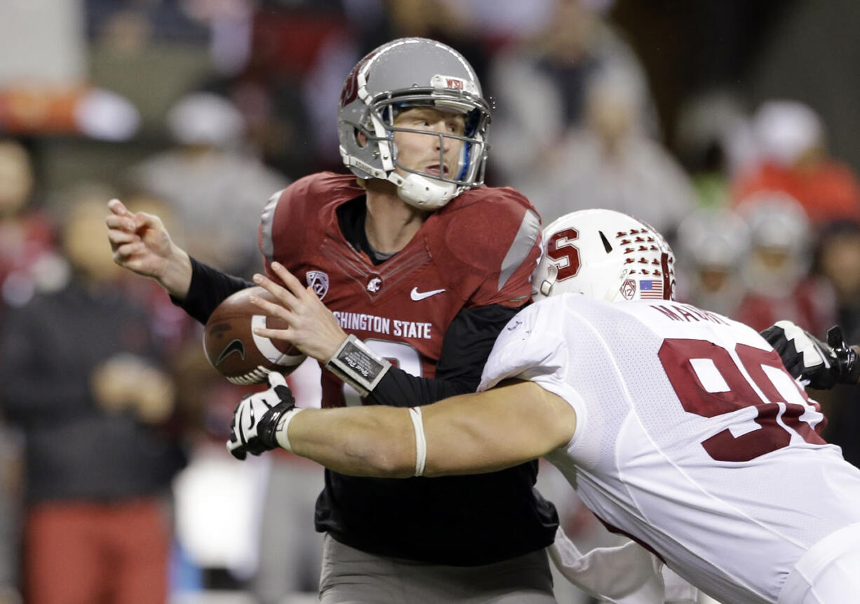 Stanford's Josh Mauro, right, forces a fumble by Washington State quarterback Connor Halliday on a sack in the first half Saturday.