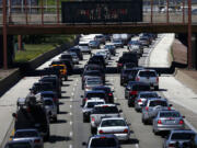 Traffic on a Chicago interstate begins to thicken Friday afternoon as travelers head to Memorial Day destinations in Indiana and Michigan.