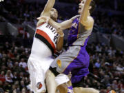 DON RYAN/The Associated Press
Portland forward Nicolas Batum tries to stop Phoenix guard Goran Dragic as the Blazers' rally from a 16-point fourth-quarter deficit comes up just short.