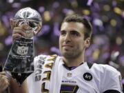 Baltimore Ravens quarterback Joe Flacco holds the Vince Lombardi Trophy after defeating the San Francisco 49ers 34-31 in Super Bowl XLVII.