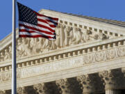 An American flag flies in front of the Supreme Court in Washington.