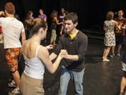 Jeremy Halpern, center, a civil engineering major, swing dances with Ali Lamens during a Northwestern University class called Whole Body Thinking, in Evanston, Ill.