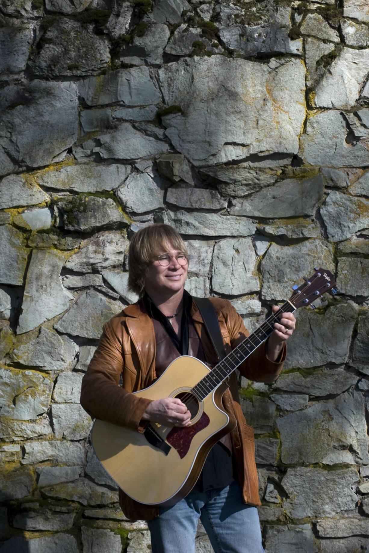 Former Woodland resident Ted Vigil performs as John Denver.