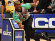 In this photo taken on Jan. 27, 2013, and provided by the Professional Bowlers Association, former NFL football player Terrell  Owens bowls during the PBA Detroit Winter Swing at Thunderbowl Lanes in Allen Park, Mich. Owens has finally found a sport where he doesn't have to worry about getting the ball. He wants to be a professional bowler.