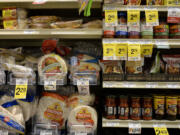 Tortillas and other items are fill shelves in the international food aisle of a grocery store Wednesday in Washington.