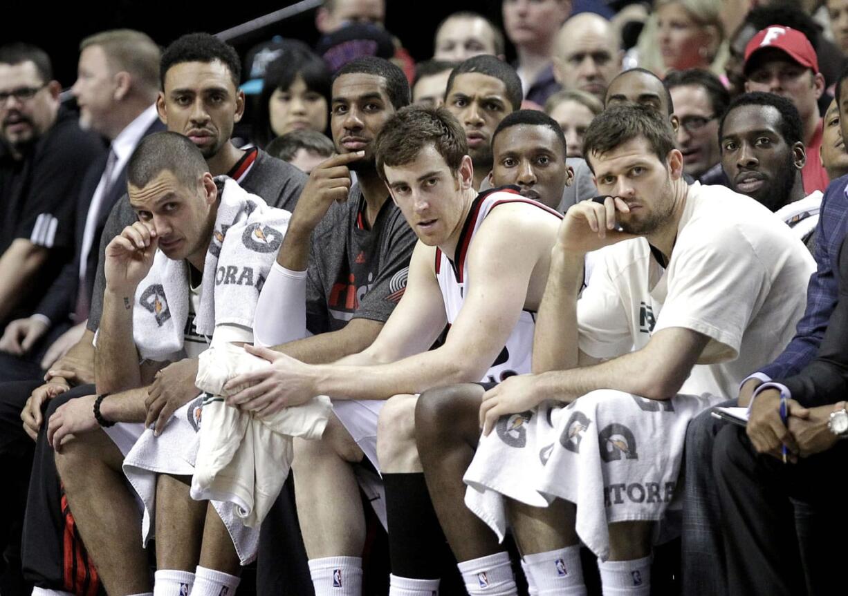 The Portland Trail Blazers bench watches during the final moments of an NBA basketball game against the Oklahoma City Thunder in Portland, Ore., Friday, April 12, 2013.