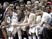 The Portland Trail Blazers bench watches during the final moments of an NBA basketball game against the Oklahoma City Thunder in Portland, Ore., Friday, April 12, 2013.