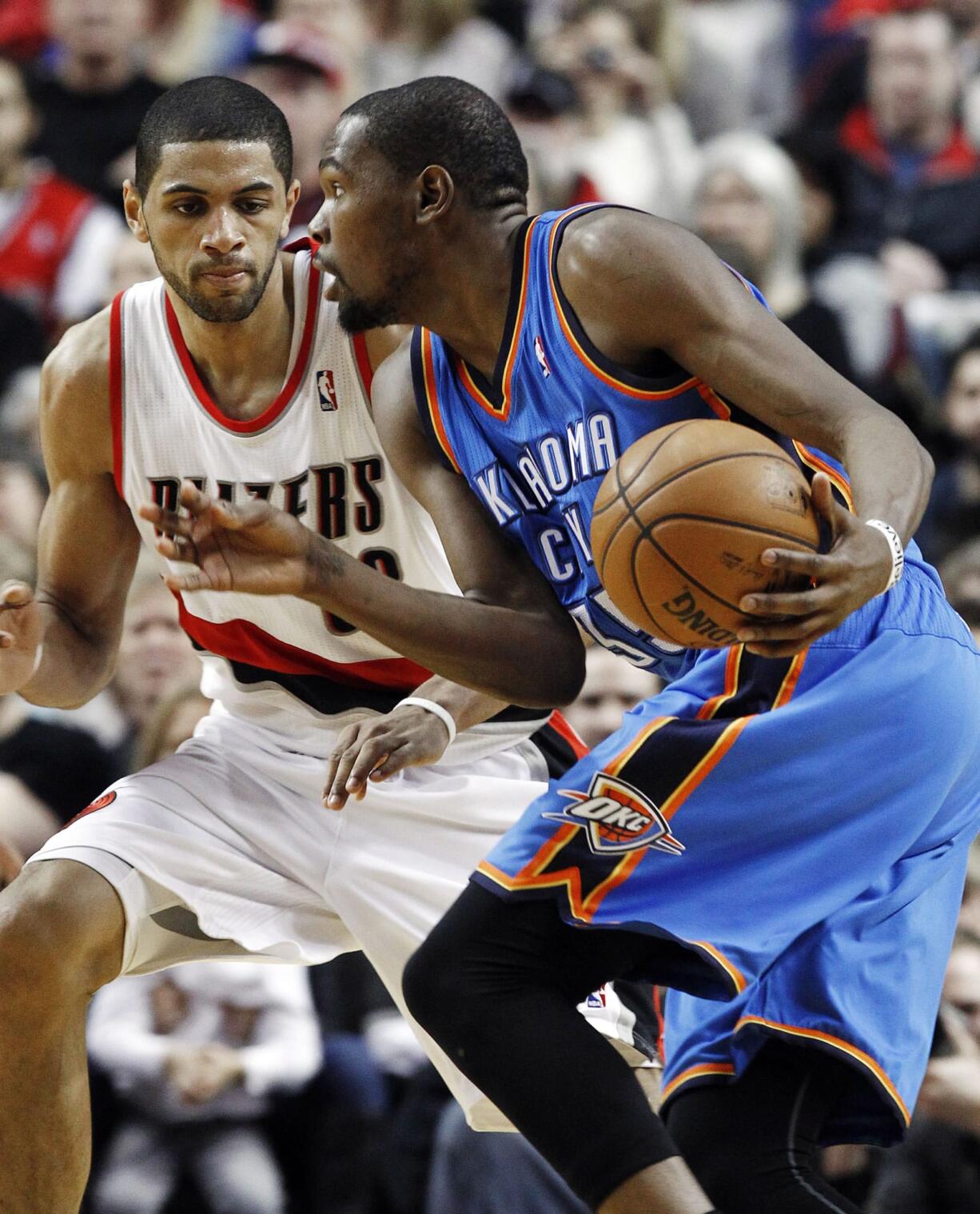 Oklahoma City Thunder forward Kevin Durant, right, drives on Portland Trail Blazers forward Nicolas Batum during the second half Sunday.