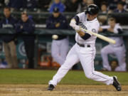 Seattle Mariners' Kyle Seager hits an RBI-double against the Detroit Tigers in the seventh inning Thursday.